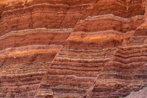 Fault lines and colorful layers in sandstone also useful as a background or texture.